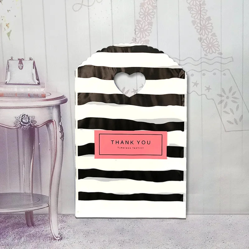 50pcs/lot Various Patterns Jewelry Plastic Bag Heart-Shaped Oval Handles Mini Gift Packing Bag Store Small Shopping Bags