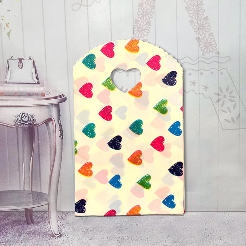 50pcs/lot Various Patterns Jewelry Plastic Bag Heart-Shaped Oval Handles Mini Gift Packing Bag Store Small Shopping Bags
