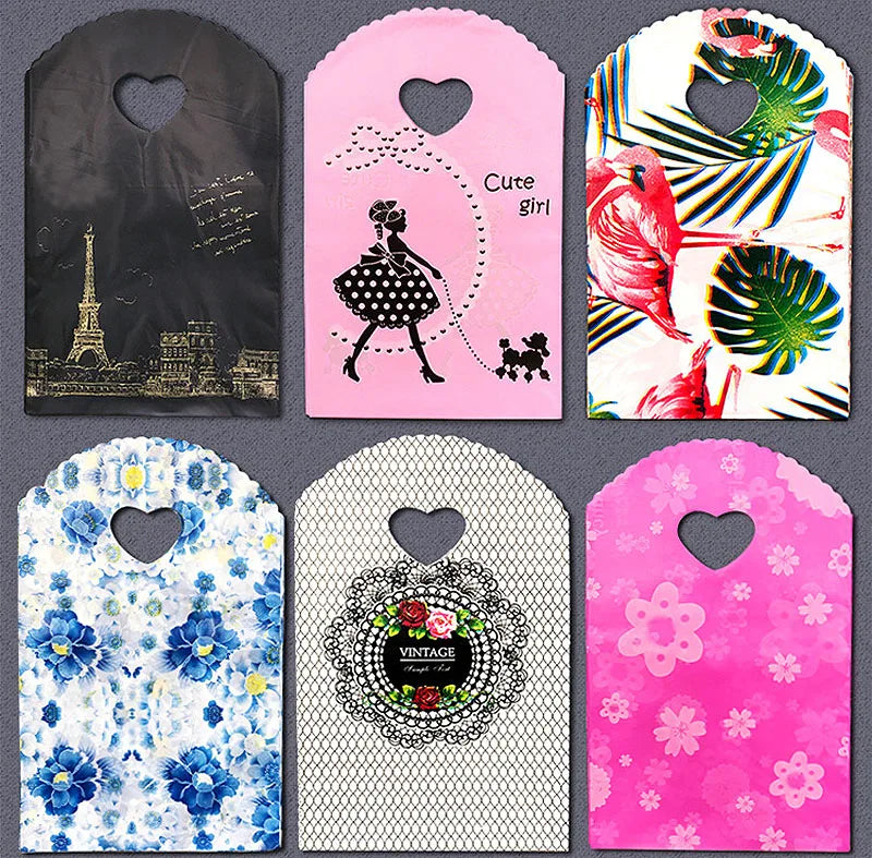 50pcs/lot Various Patterns Jewelry Plastic Bag Heart-Shaped Oval Handles Mini Gift Packing Bag Store Small Shopping Bags