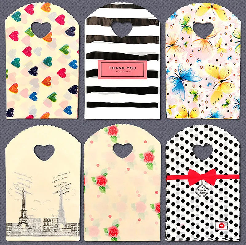 50pcs/lot Various Patterns Jewelry Plastic Bag Heart-Shaped Oval Handles Mini Gift Packing Bag Store Small Shopping Bags