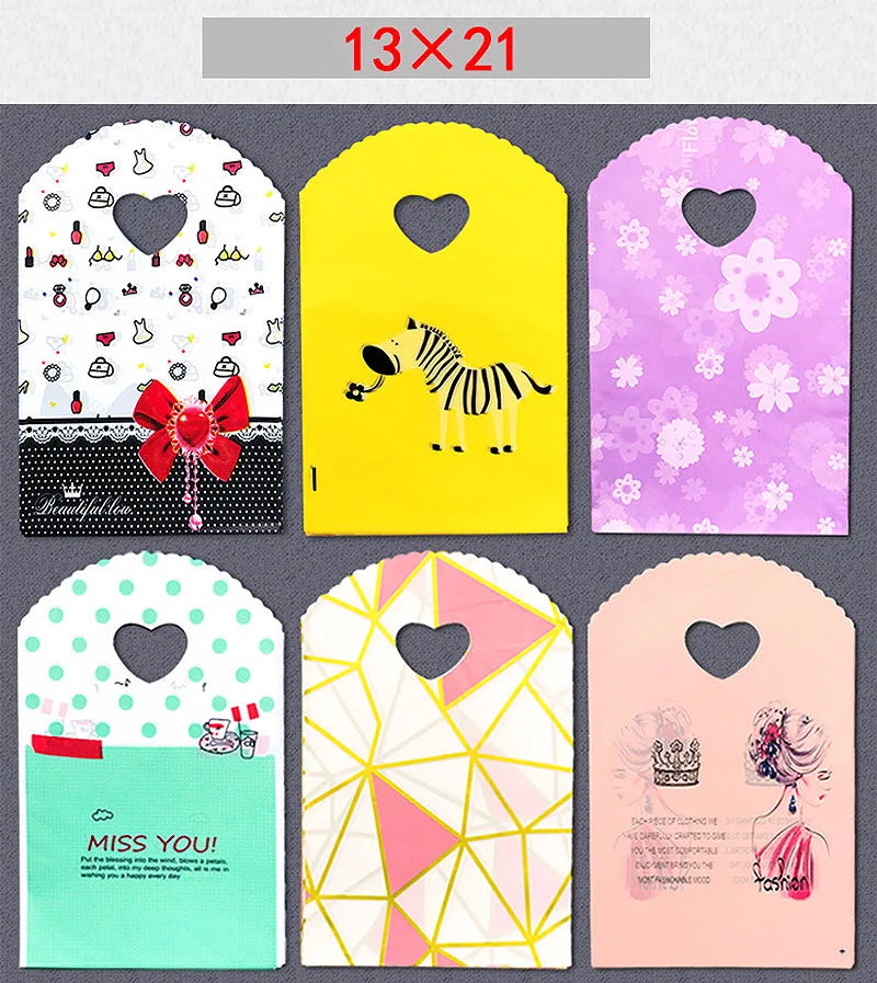 50pcs/lot Various Patterns Jewelry Plastic Bag Heart-Shaped Oval Handles Mini Gift Packing Bag Store Small Shopping Bags