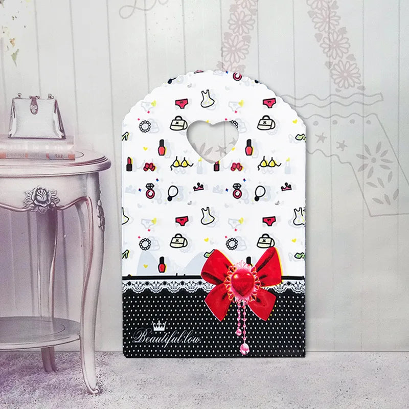 50pcs/lot Various Patterns Jewelry Plastic Bag Heart-Shaped Oval Handles Mini Gift Packing Bag Store Small Shopping Bags