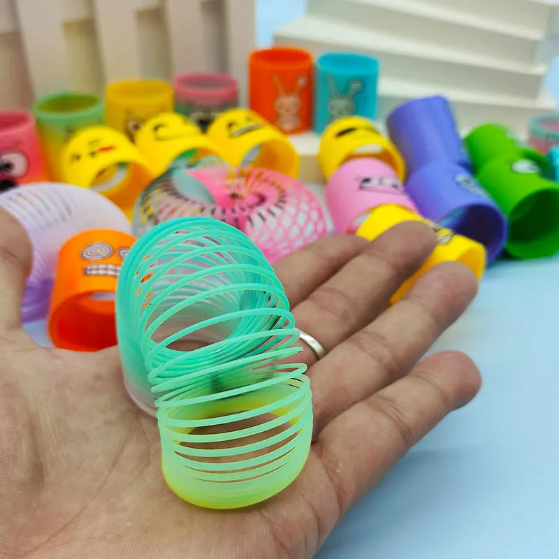 12Pcs Neon Rainbow Plastic Smile Magic Spring Toys for Children Birthday Party Favors Piñata Fillers Carnival Prizes Goodie Bag
